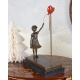Fata cu balon-statueta din bronz cu un soclu din marmura